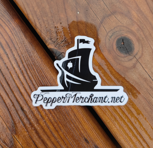 The PepperMerchant.net Sticker features a black pirate ship and "PepperMerchant.net" in decorative script on wood, reflecting the brand’s premium seeds and hydroponics focus.